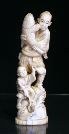 Appraisal: A Japanese carved walrus tusk figural group of a fisherman