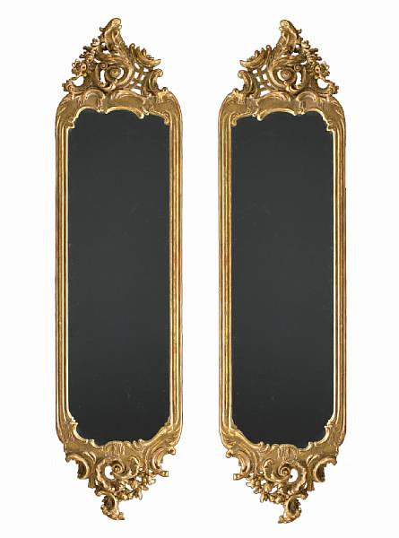 Appraisal: A pair of Rococo style giltwood pier mirrors first half