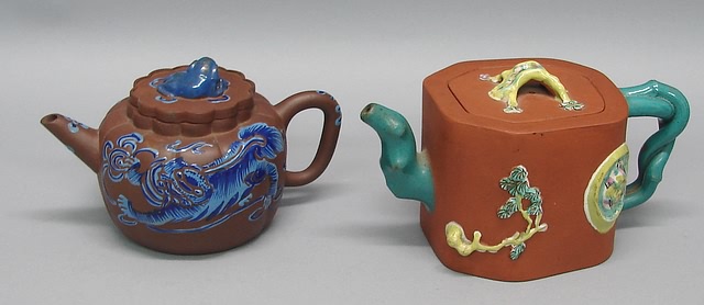 Appraisal: One Banko brown blue stoneware teapot Applied enamel shishi and