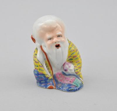 Appraisal: Porcelain Seated Priest Porcelain molded hollow form of a seated