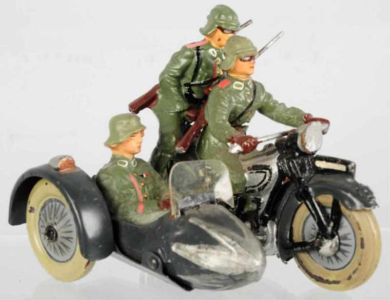 Appraisal: Lineol Motorcycle with Sidecar Passengers Includes three German soldiers Condition