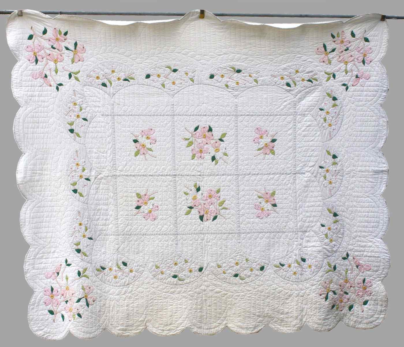 Appraisal: HAND-SEWN APPLIQUE COTTON QUILTAmerican Circa In Dogwood Blossom'' pattern Scalloped