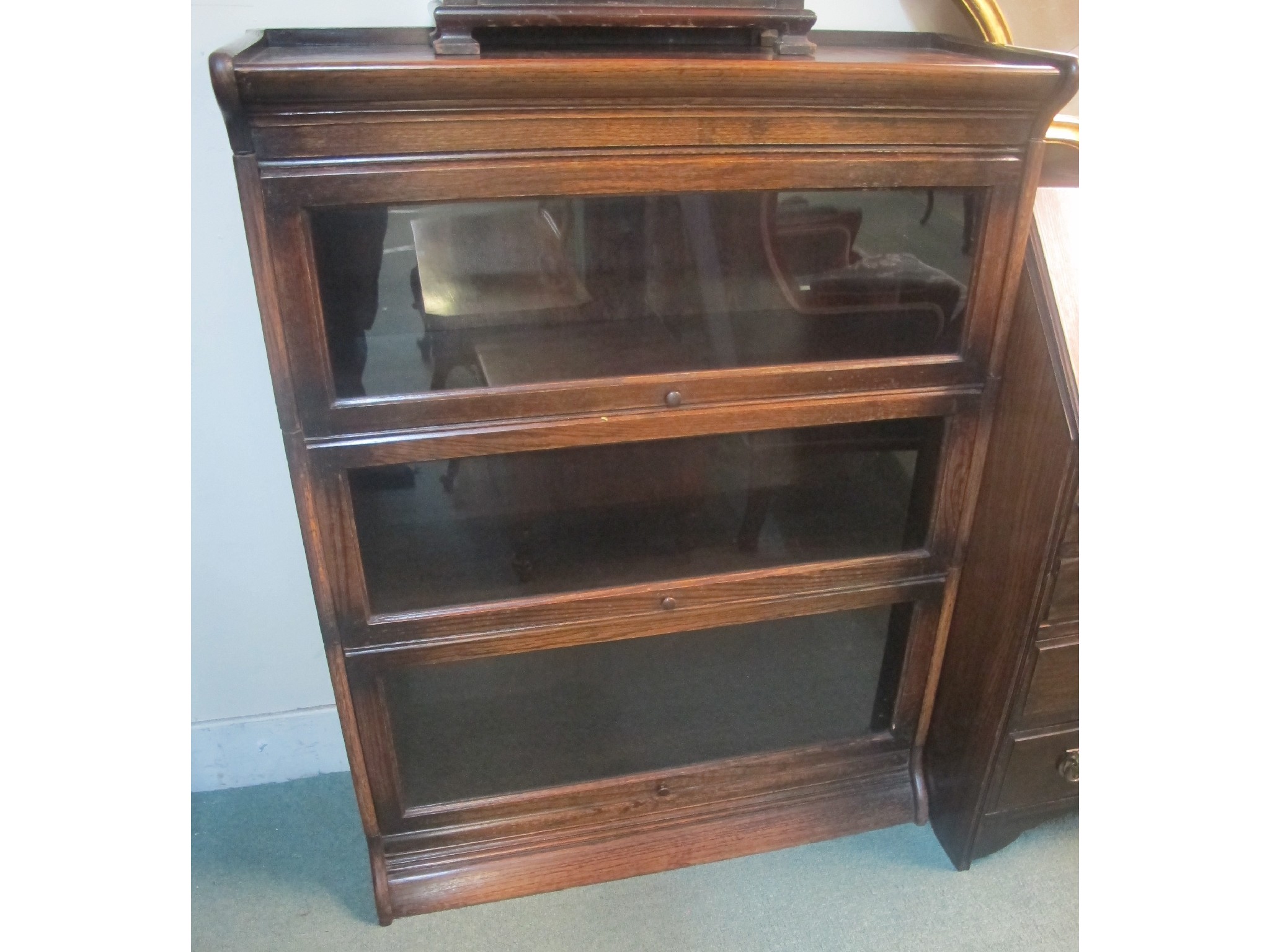 Appraisal: An oak three section bookcase