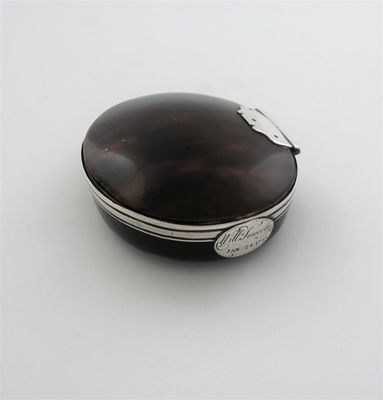 Appraisal: A George II mounted tortoiseshell oval tobacco box with a