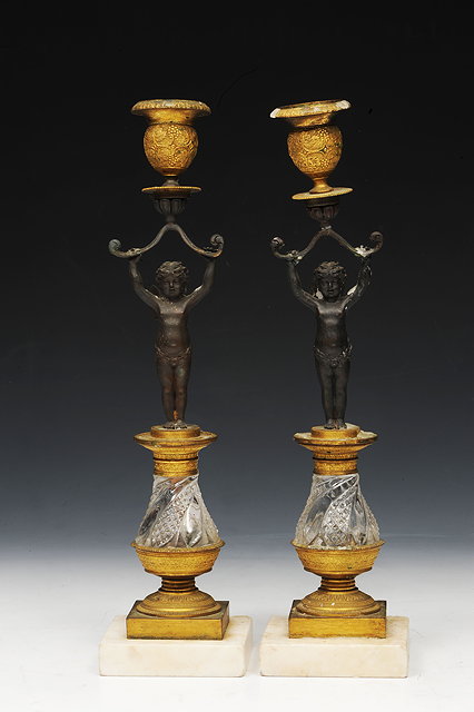 Appraisal: A PAIR OF FRENCH REGENCE CANDELABRA the columns in the