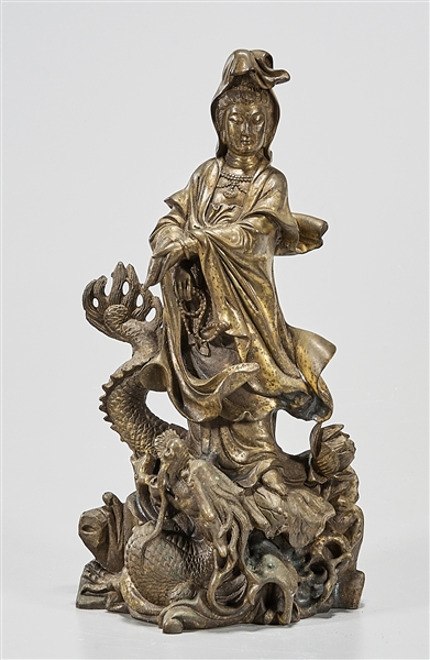 Appraisal: Chinese bronze figure of Guanyin standing on a dragon x