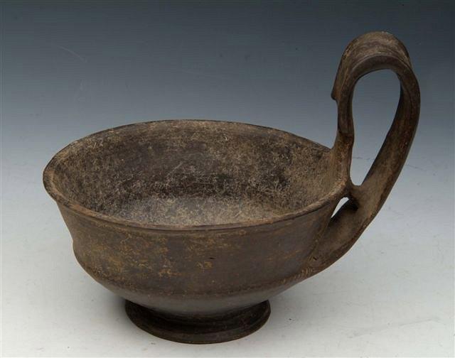 Appraisal: AN ETRUSCAN BUCCHERO WARE DEEP CUP with flared handle and