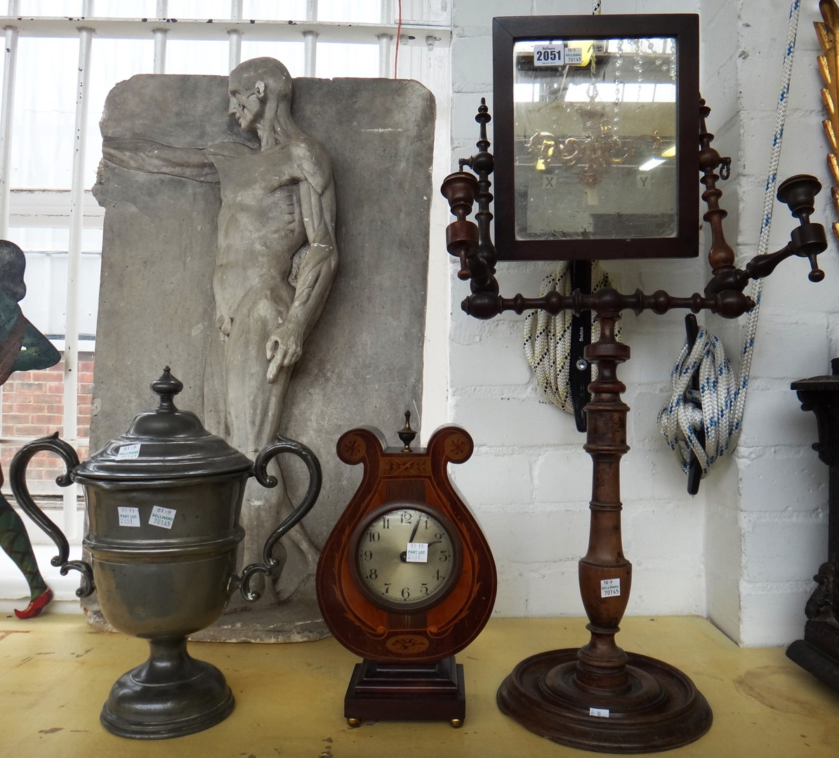 Appraisal: An Edwardian mahogany and marquetry inlaid lyre shaped mantel clock