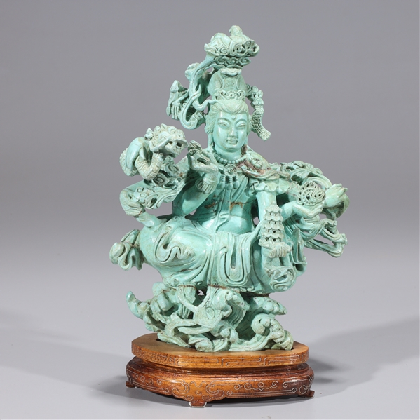 Appraisal: Large Chinese carving of seated multi-armed deity with wood stand