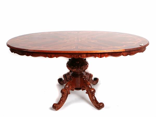 Appraisal: A Continental Rococo style marquetry inlaid oval center table height