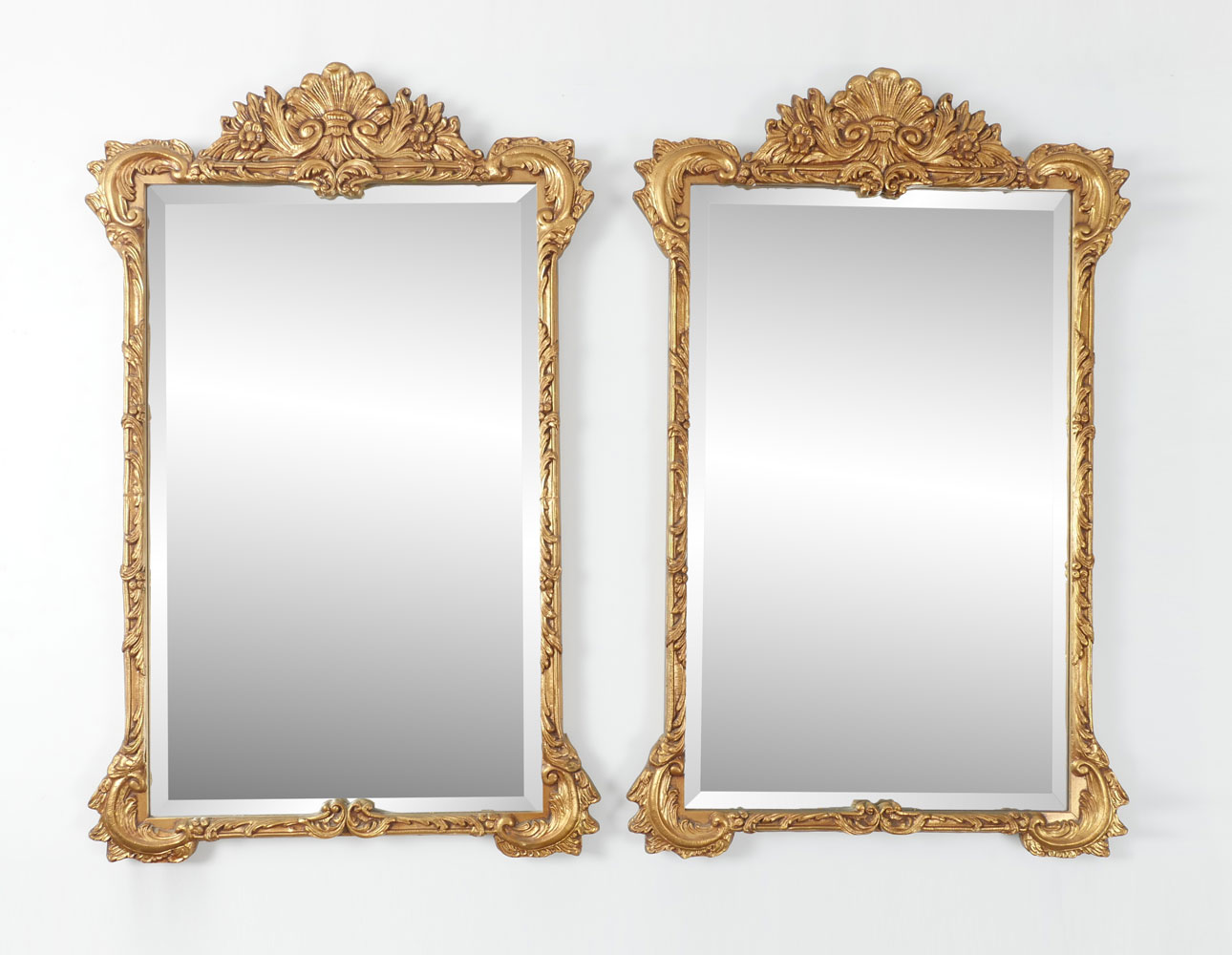 Appraisal: PAIR GILT WALL MIRRORS - Beveled mirrors having an encompassing