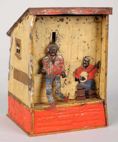 Appraisal: Hand-Painted Tin Weeden's Plantation Bank Both tin figures are original