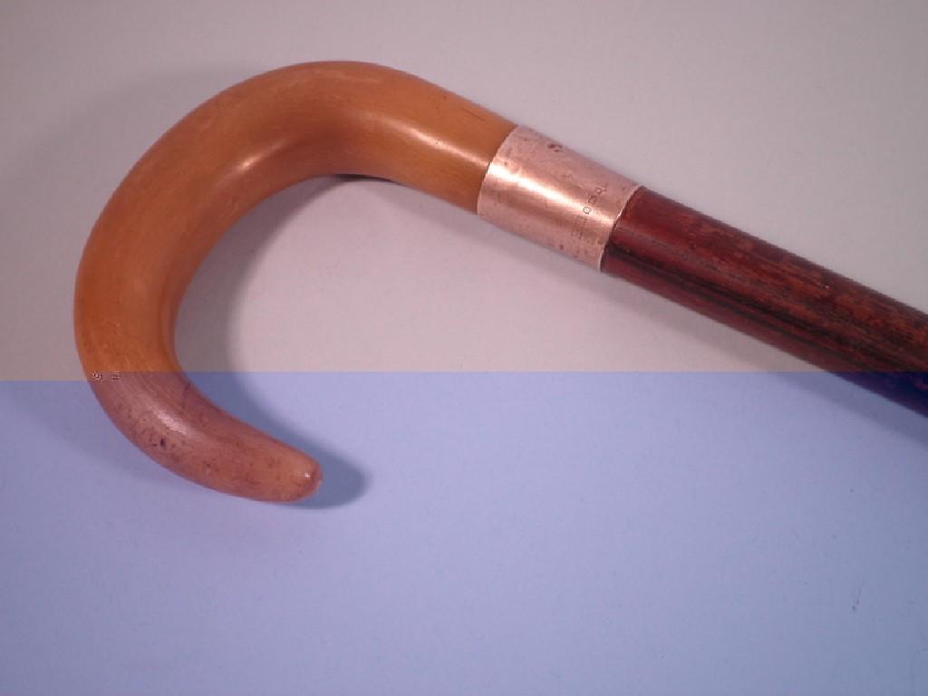 Appraisal: An Edwardian rosewood walking stick with a silver collar and