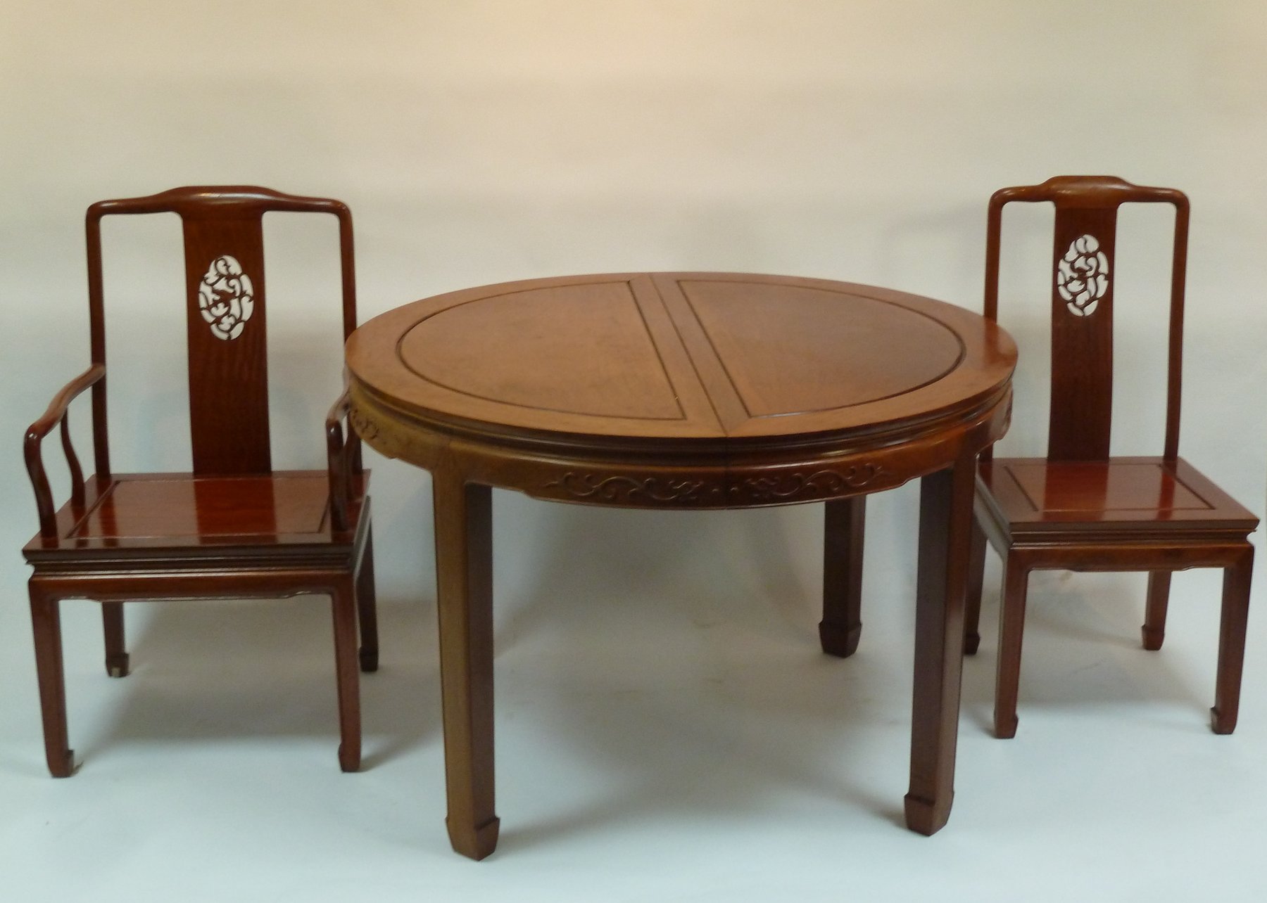 Appraisal: A Chinese hardwood dining table and eight chairs the chairs