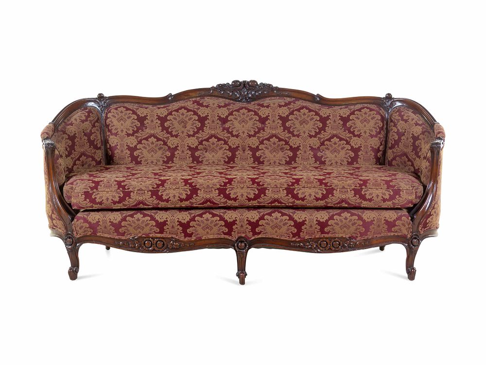 Appraisal: A Rococo Revival Carved Walnut Sofa A Rococo Revival Carved