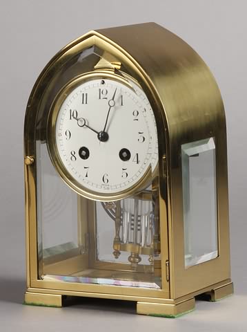 Appraisal: Circa polished brass case day time and strike movement porcelain