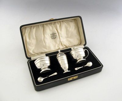 Appraisal: A three-piece silver Art Deco condiment set of tapering circular