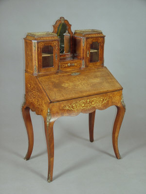 Appraisal: A Victorian walnut and marquetry inlaid writing desk circa the