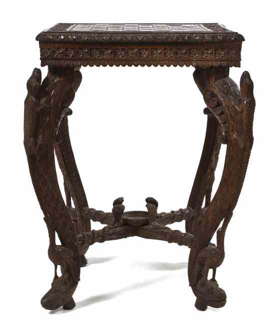 Appraisal: An Anglo Indian Carved Hardwood Games Table the square top