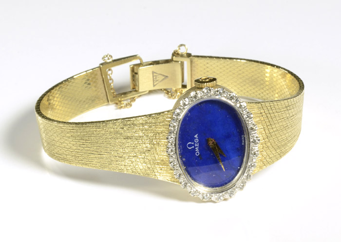 Appraisal: LADY'S OMEGA DIAMOND AND FOURTEEN KARAT GOLD WRISTWATCH having an