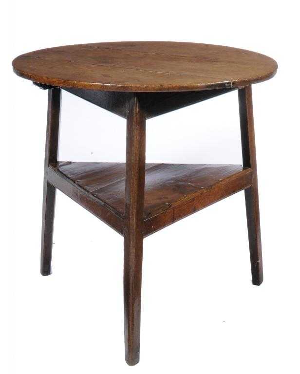 Appraisal: A GEORGE III OAK CRICKET TABLE on moulded triangular legs