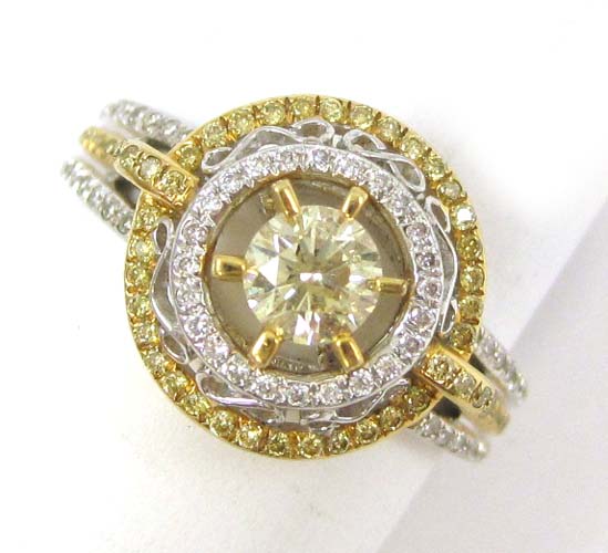 Appraisal: DIAMOND AND EIGHTEEN KARAT GOLD RING The white and yellow