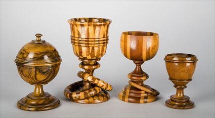 Appraisal: THREE TREENWARE GOBLETS AND A STRING JACK Including specimen pieces