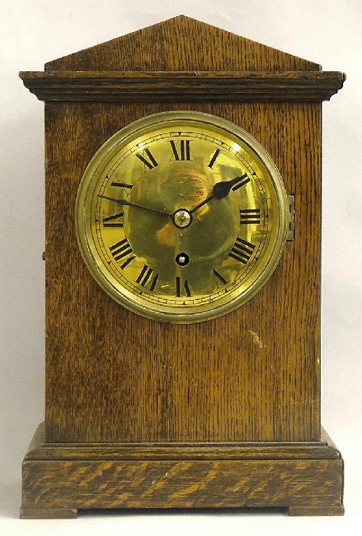 Appraisal: Oak single fusee mantel clock the brass dial within a