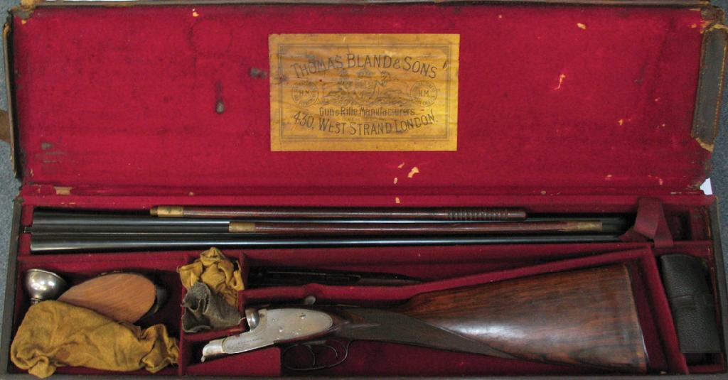 Appraisal: A DOUBLE BARRELLED SHOTGUN the stock with silvered mounts engraved