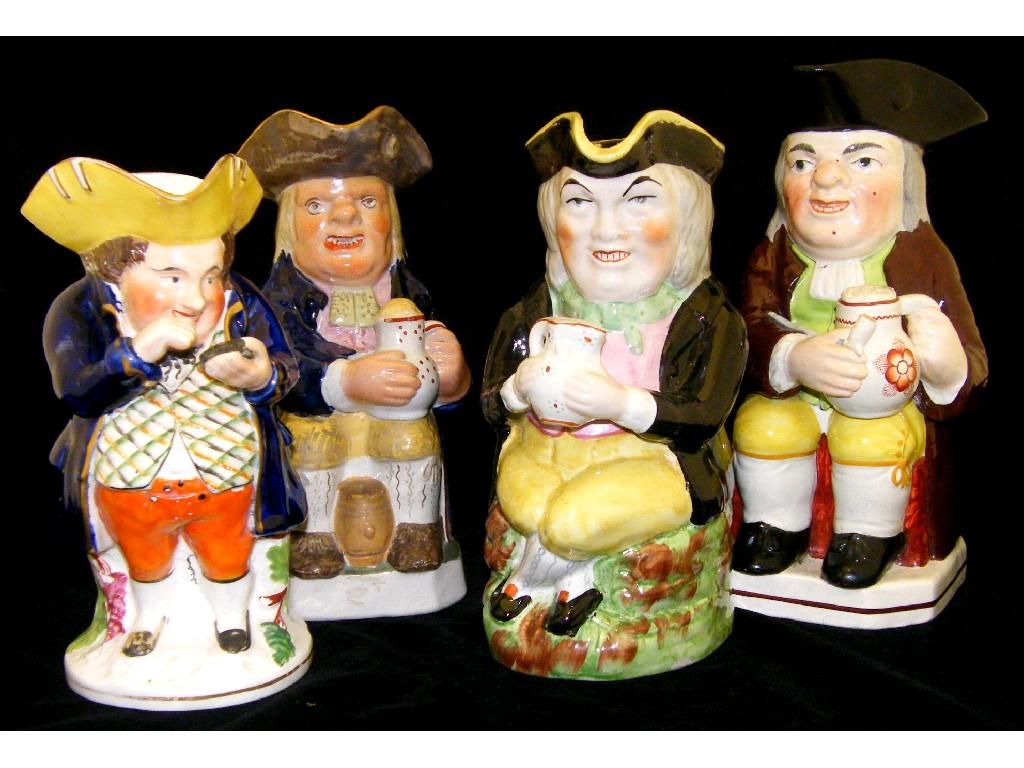 Appraisal: th century pearlware Staffordshire Toby jug and three other Staffordshire