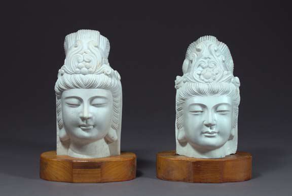 Appraisal: Near-Pair of Indo-Chinese Carved White Marble Heads of Buddha each