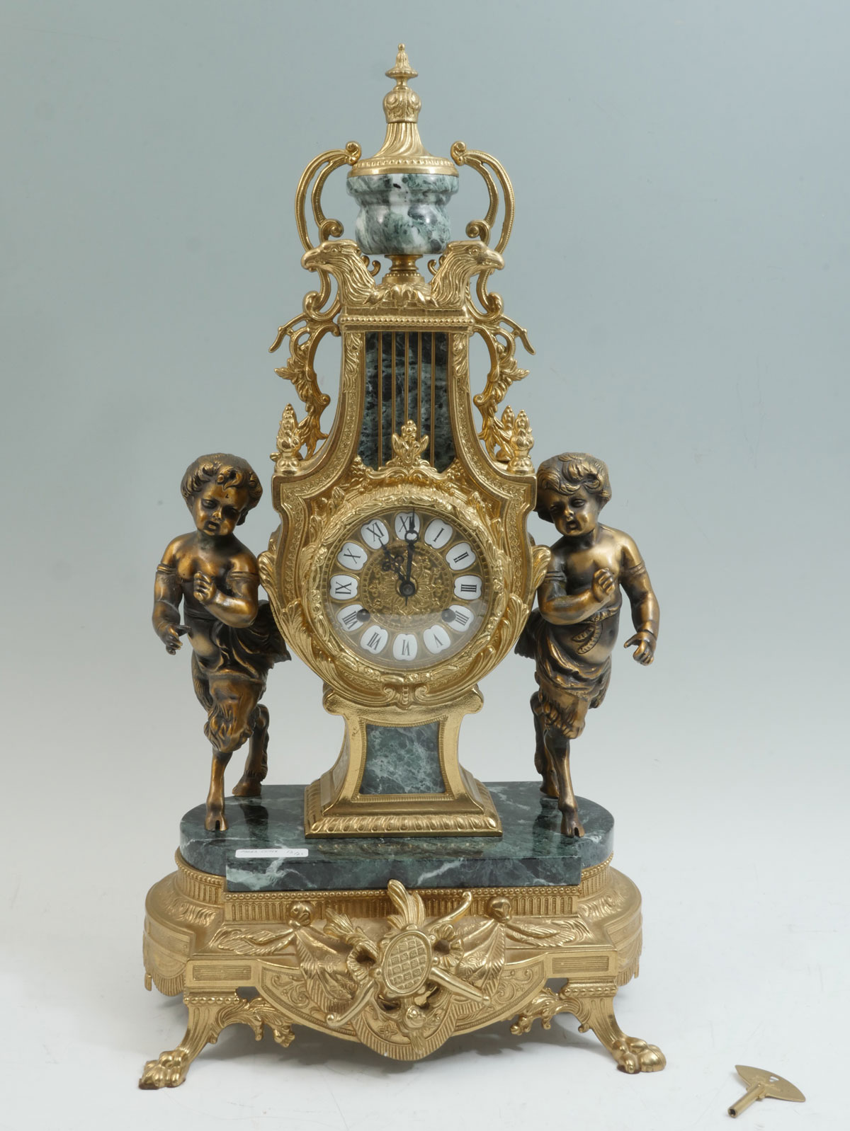 Appraisal: FRANZ HERMIE BRASS MARBLE IMPERIAL CLOCK Surmounting urn over opposing