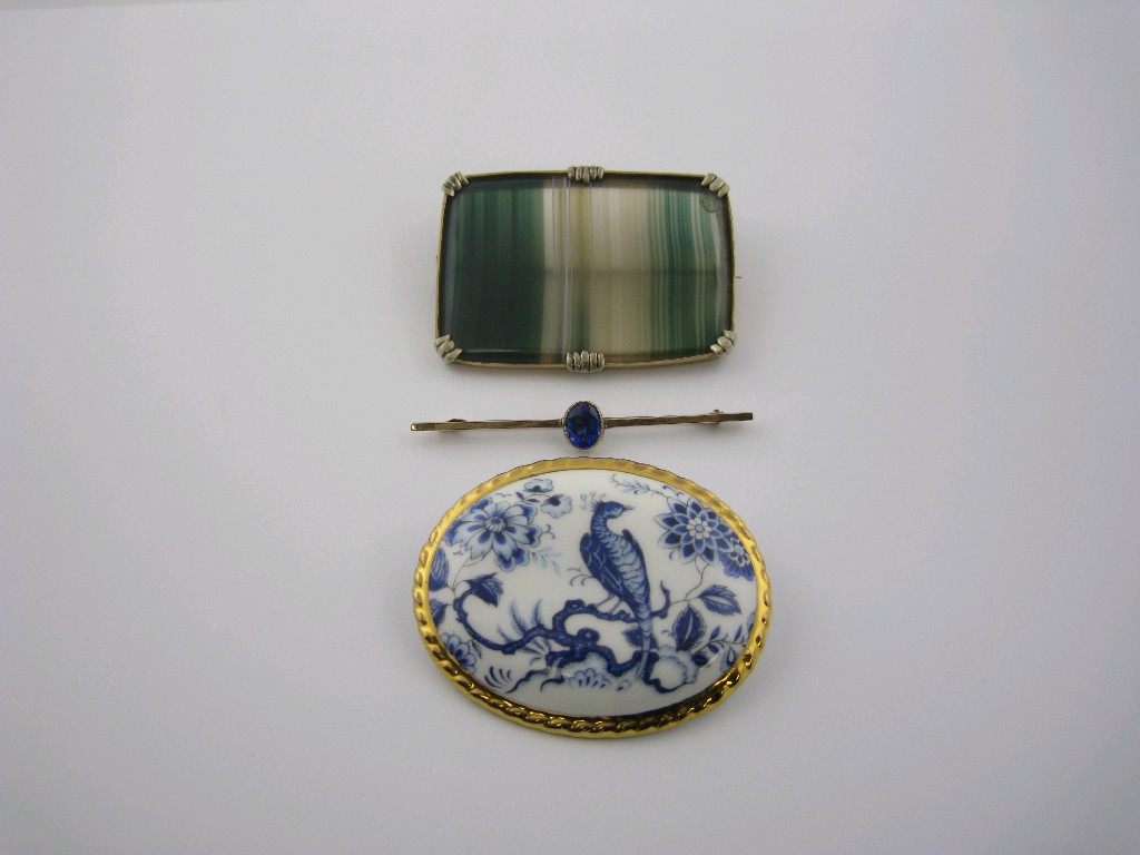 Appraisal: A banded Agate Brooch the rectangular stone claw-set in frame