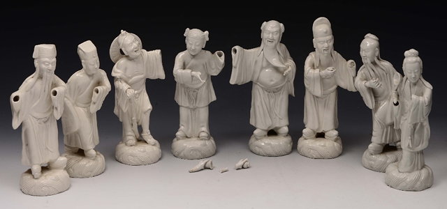 Appraisal: A COLLECTION OF EIGHT CHINESE WHITE GLAZED FIGURES on scroll