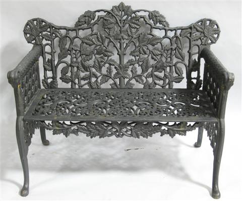 Appraisal: BLACK PAINTED WROUGHT IRON GARDEN BENCH th century the shaped