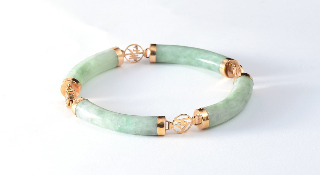 Appraisal: K NEPHRITE JADE BRACELET K yellow gold findings with curved