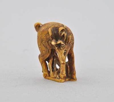 Appraisal: Standing Elk Netsuke Carved ivory Elk cleaning his leg rubbed