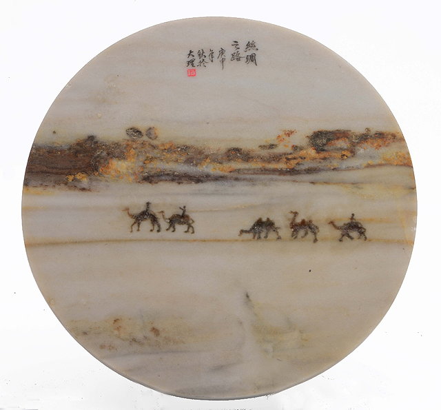 Appraisal: A Chinese circular dreamstoneRepublic period - having a camel train