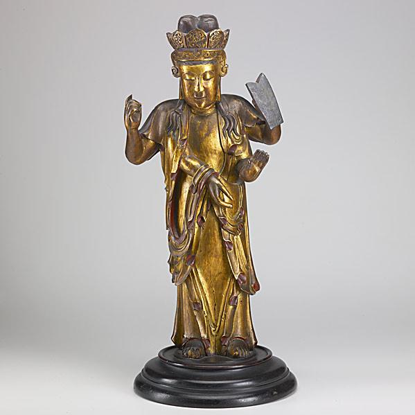 Appraisal: ASIAN CARVED WOOD STATUEFour-armed deity with gilded decoration th c