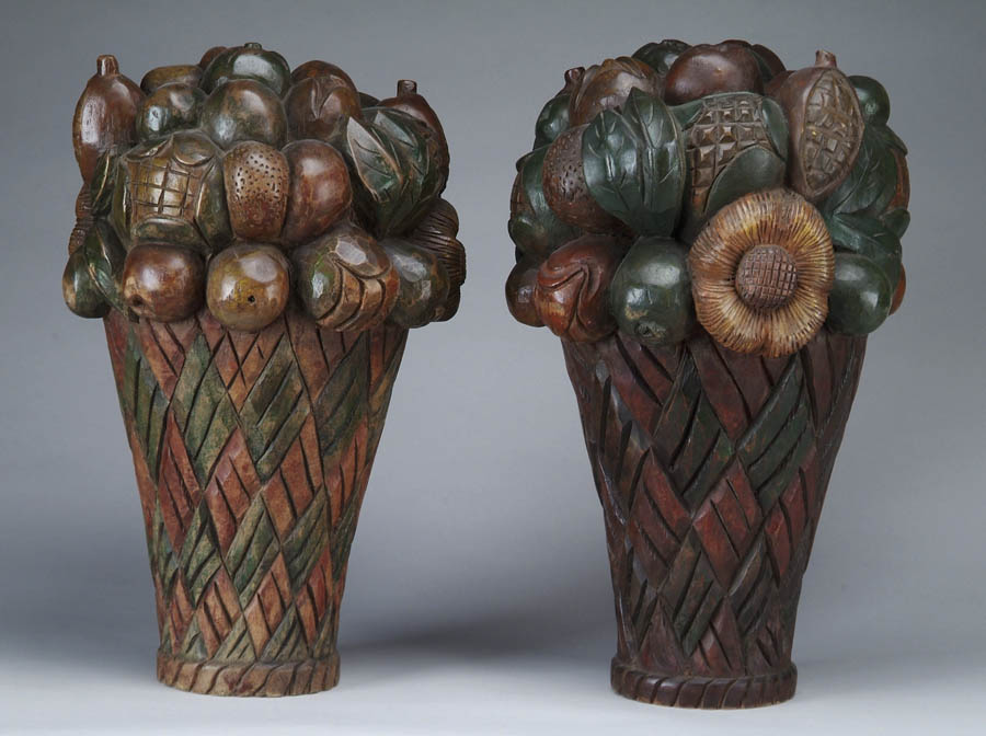 Appraisal: PAIR OF CARVED AND POLYCHROME FRUIT DECORATED OVERSIZE FINIALS Tall