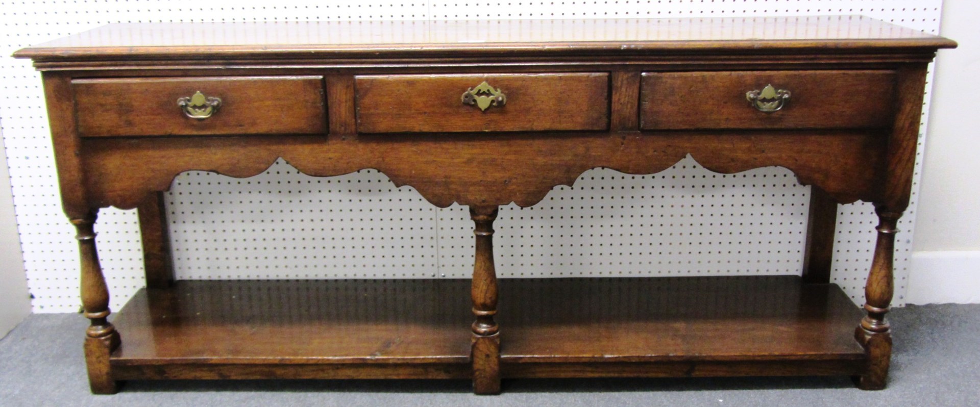 Appraisal: An th century style oak dresser base with three frieze