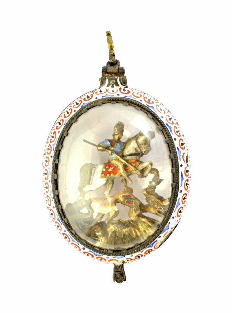 Appraisal: An enamelled oval pendant locket glazed within with St George