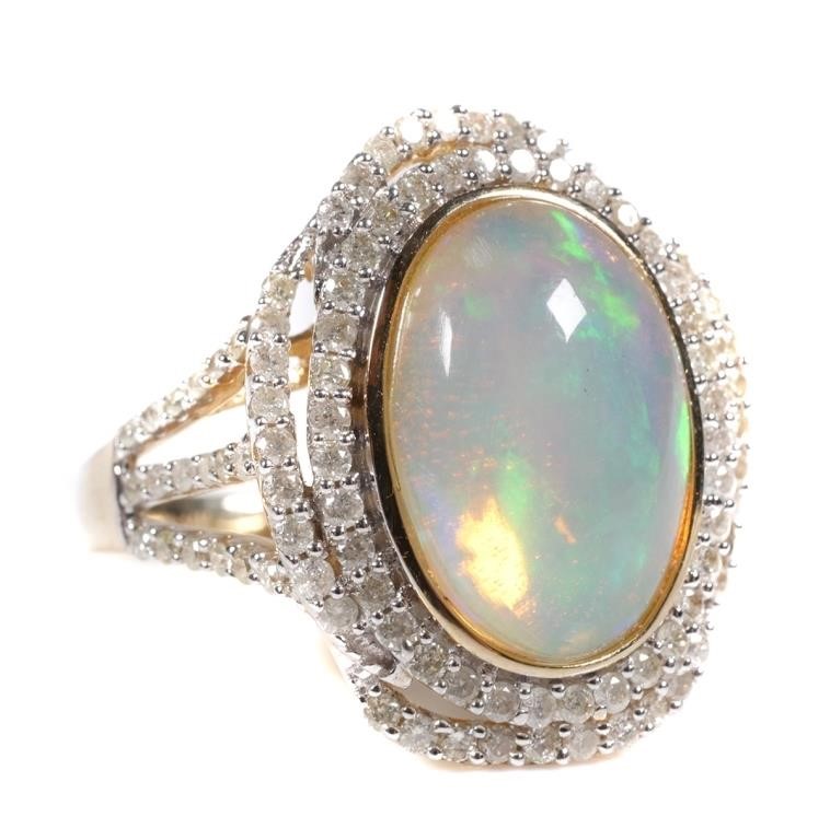 Appraisal: Beautiful carat opal cabochon framed by carats of diamonds Size