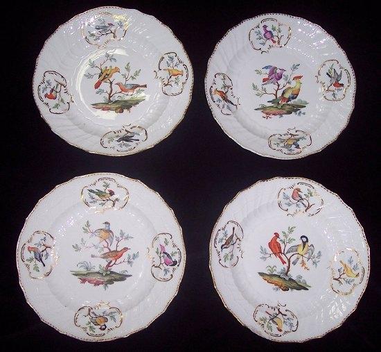 Appraisal: Four Meissen dessert plates each painted two exotic birds on