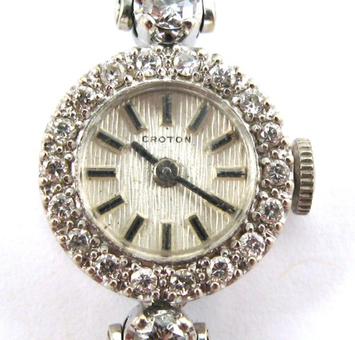 Appraisal: LADY'S DIAMOND AND FOURTEEN KARAT GOLD WRISTWATCH WITH APPRAISAL with