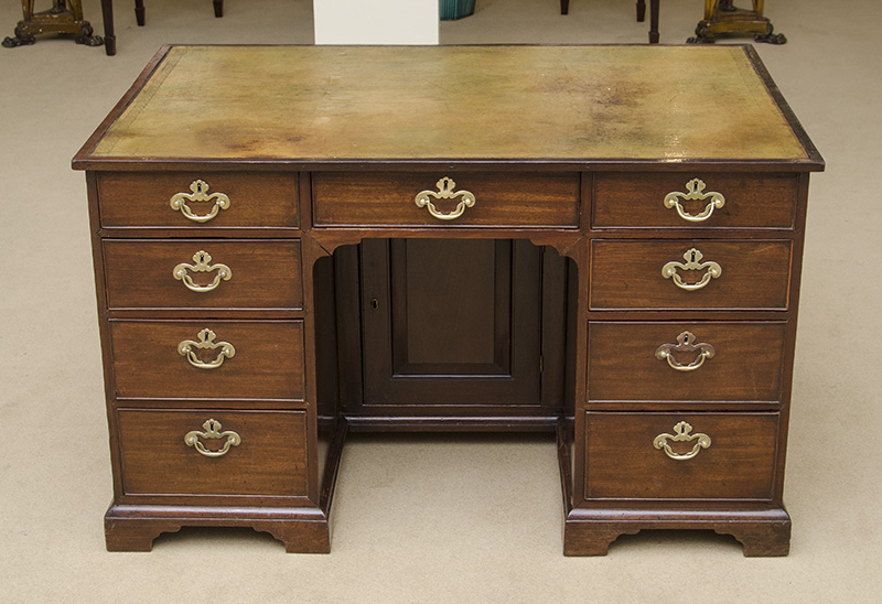 Appraisal: GEORGE III MAHOGANY KNEEHOLE DESK With a gilt-tooled leather-lined writing