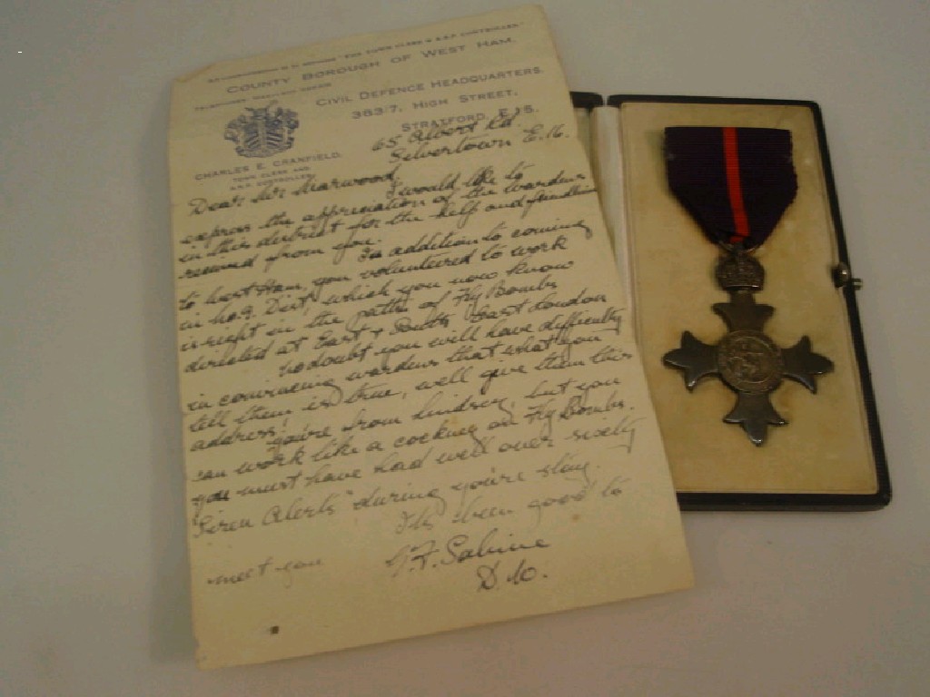 Appraisal: A cased military MBE together with accompanying letter from the