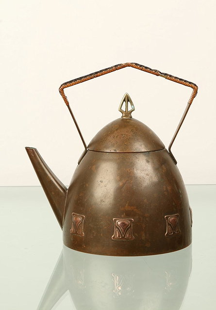 Appraisal: WMFSecessionist kettle circa copper with caned handle and decorative motifsimpressed