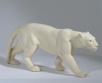 Appraisal: A Sevres earthenware model of a prowling lioness covered in