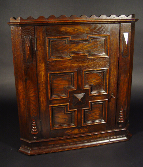 Appraisal: Oak hanging corner cabinet of small proportions fitted with a